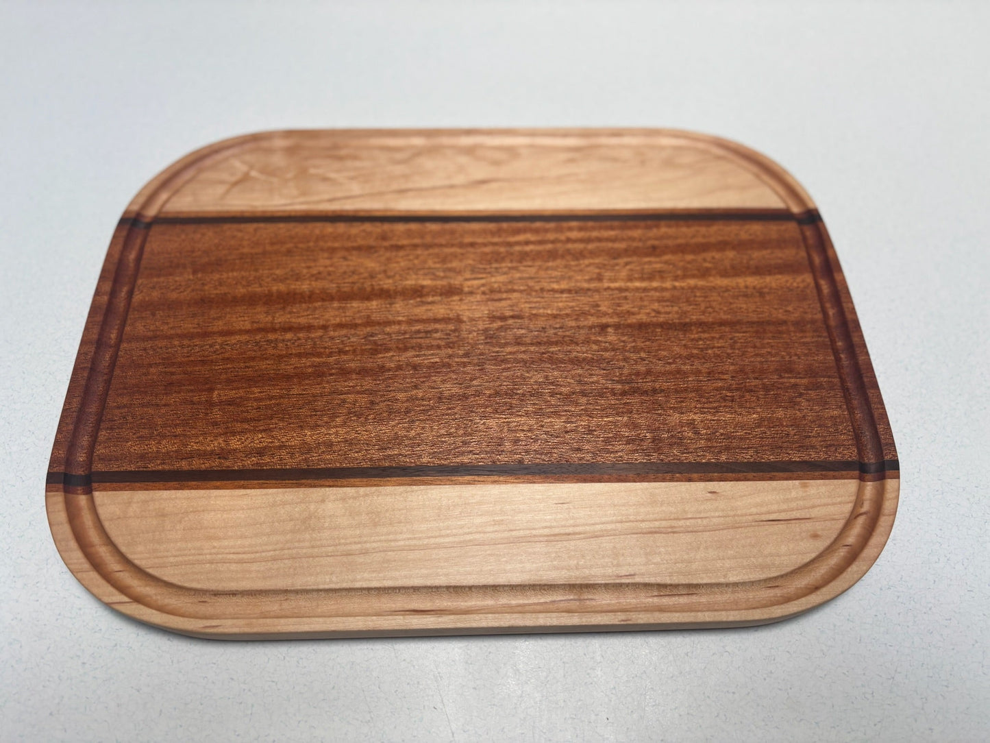 Medium Cutting Board- African Mahogany, White Maple, Black Walnut Accents