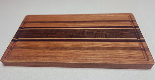 Medium Butcher Block- Red Oak, Black Walnut, Purple Heart and Hard White Maple accents.